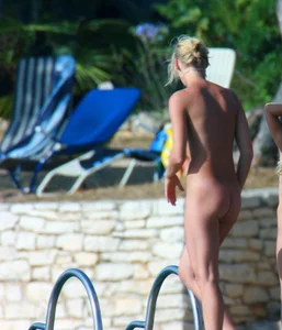 Sexy and skinny blonde nudist milf on the beach