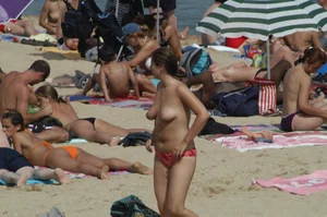 Topless girls on a beach in Barcelona