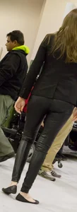 Pretty car saleswoman in tight shiny black pants with nice ass