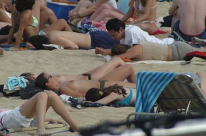 Topless girls on a beach in Barcelona