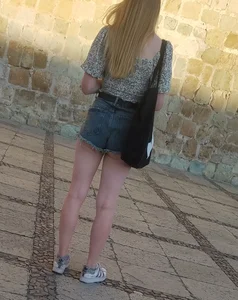 Blonde in short shorts, legs and a peach in sight