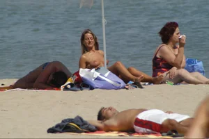 Girls on a nude beach in Sitges, Spain