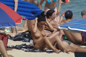 Topless girls on a beach in Barcelona