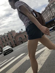 Young Girl in Shorts And Sandals Crossing the Street Gallery
