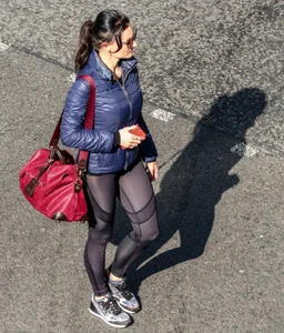 Brunette lady in leggings out walking