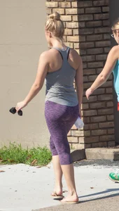 Sexy blonde out walking in purple leggings with a nice ass