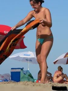 2 topless thonged sexy friends on the beach with great bodies