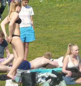 Teen taking off her dress in the park