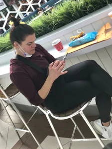 Candid sexy ass in leggings at an airport eatery