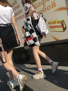 Couple of Skinny Girls in Mini-Skirts And Sneakers Street Photos