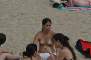 Topless girls on a beach in Barcelona