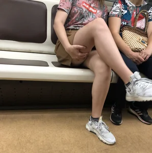 Amazing Hot Girl in a Skirt and Sneakers Sitting Cross-Legged in the Subway Train and on the Escalator Candid Photos Gallery