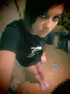 Cute Barefoot Teen in a T-Shirt And No Pants On Taking a Selfie