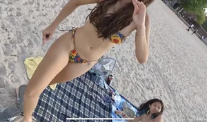 Couple of young and skinny candid girls at the beach creepshots, they noticed the photographer