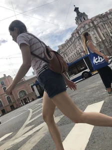Young Girl in Shorts And Sandals Crossing the Street Gallery