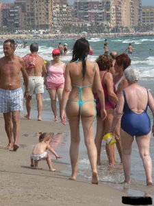 Bunch of sexy babes at the beach in thong bikinis