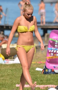 Blonde looking sexy in a yellow bikin