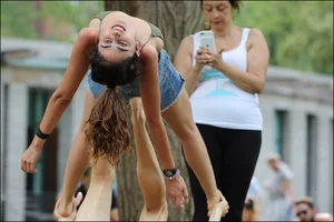 Gymnast or yoga girl in the park in shorts and no bra and even showing some pussy
