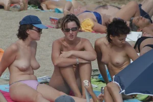 Topless girls on a beach in Barcelona