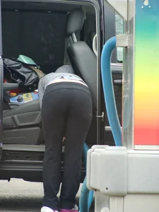 Girls cleaning their cars in jeans and pants
