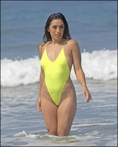 Sexy ass beach babe in a yellow thong swimsuit