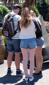 Cute girl walking in short jean shorts