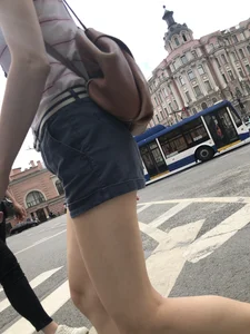 Young Girl in Shorts And Sandals Crossing the Street Gallery