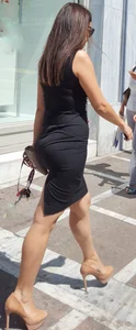 Brunette looking sexy in tight black dress with vpl