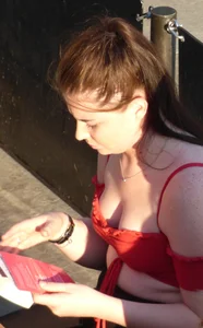 Redhead in little red top showing off her cleavage