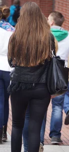 Pretty girl walking in tight black pants