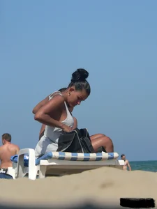 Hot ass topless beach girl with great tits lets her little brother oil up her ass in thong bikini