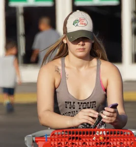 Hot blonde after shopping in short jean shorts and tank top