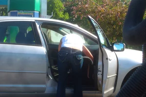 Girls cleaning their cars in jeans and pants