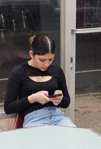 Hot latina in tight jeans at the laundromat