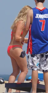 Sexy thick blonde girl with tiny bikini and big booty on the beach