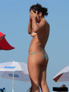 2 topless thonged sexy friends on the beach with great bodies