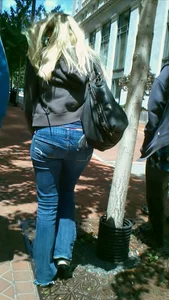 Blonde in tight jeans with her red thong sticking out