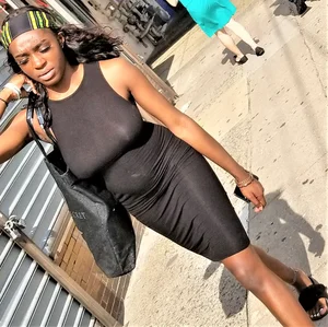 Sexy braless ebony babe in tight skirt with pokies