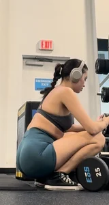 College Asian girl working out in tight blue shorts