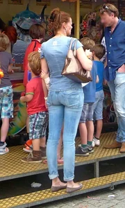 Stocky milf wearing tight jeans at the amusement park creepshot