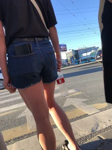 Cute candid teen wearing denim shorts crossing the street, awesome muscly legs