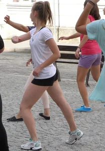 Girl Working Out on the City Street Candid Photos