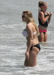 Big boobed thick blonde on the beach in a bikini