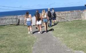 Three sexy friends in denim shorts and a skirt