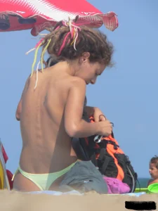 Sexy girls going topless at the beach showing off their sexy bodies