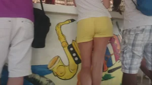 Milf in yellow shorts with vpl and a wedgie