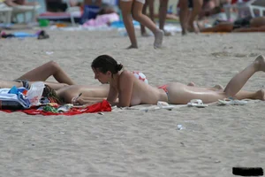 Beach voyeur girls in bikinis, thongs and topless