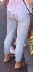 Girl in wet jeans making them semi see through