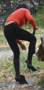 Sexy Girl in Tight Pants and Go-Go Boots Bend Over Street Creepshot