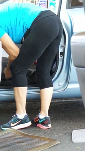 Girl in tight see through leggings with nice ass cleaning her car